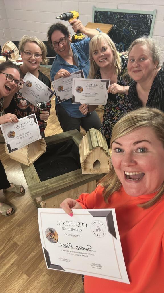 Participants celebrating after completing the one day DIY academy workshop.